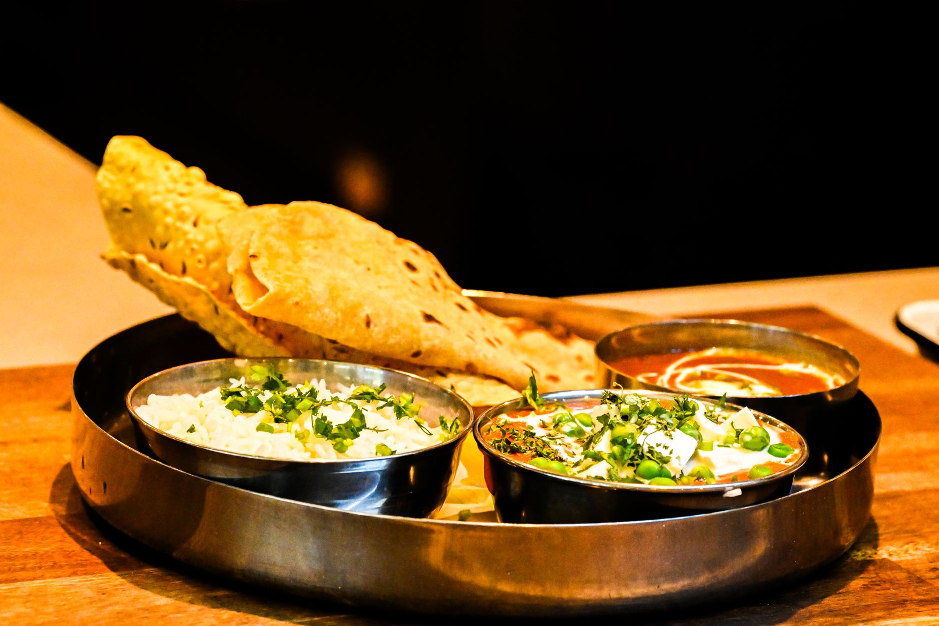 A home-style Indian thali with dal, sabzi, roti and rice